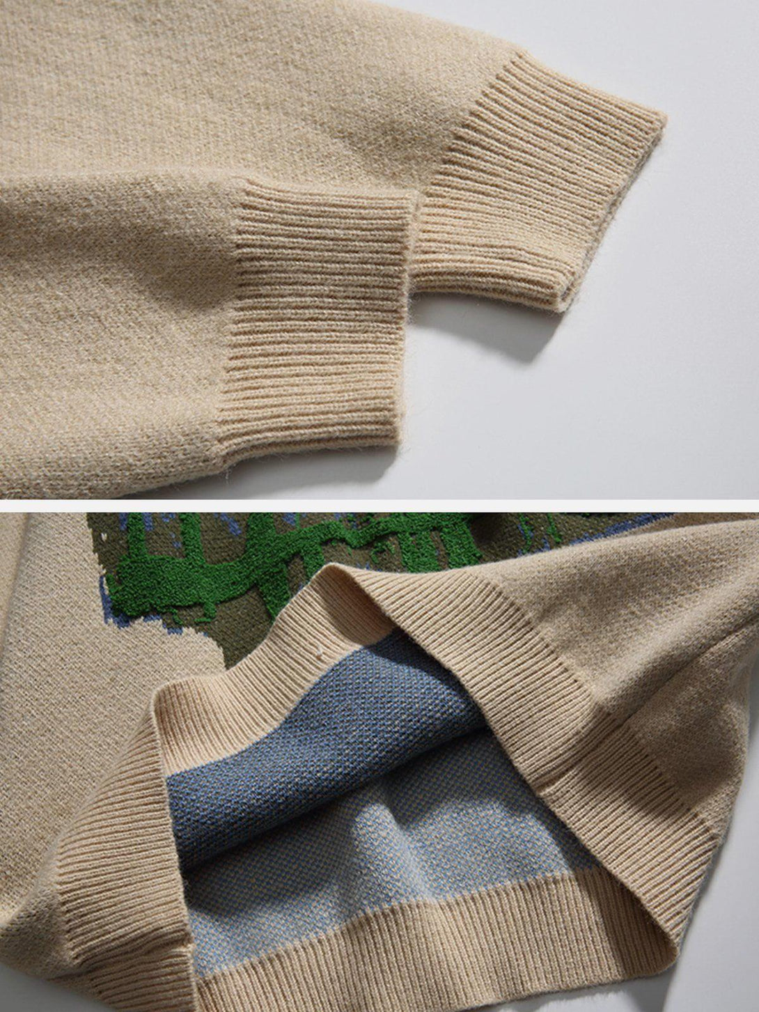 Intricate look at TALISHKO sweater's ribbed cuffs and textured knit, featuring mountain embroidery.