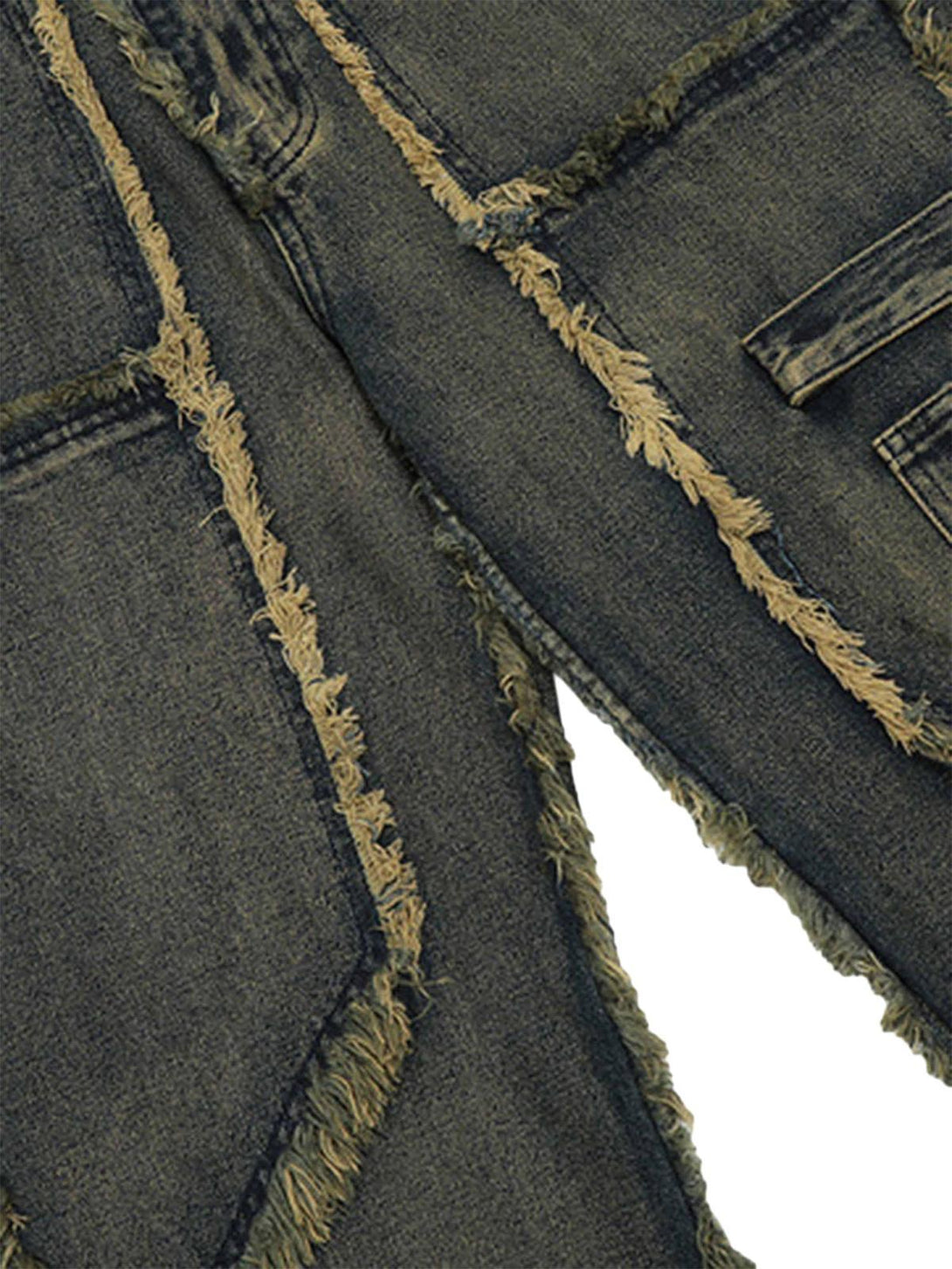 Focusing on the frayed detailing, TALISHKO jeans highlight raw hems and a distressed finish.