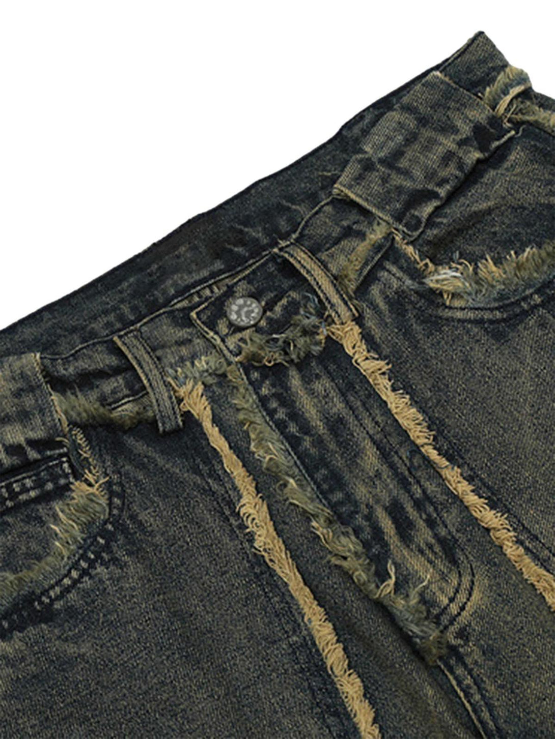 Detailed fabric and stitching on TALISHKO jeans, highlighting the raw hem and distressed style.