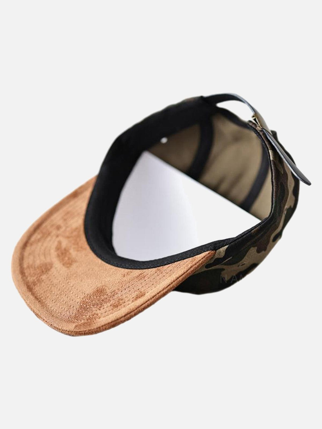A detailed view of the TALISHKO camouflage baseball cap featuring a brown suede brim.