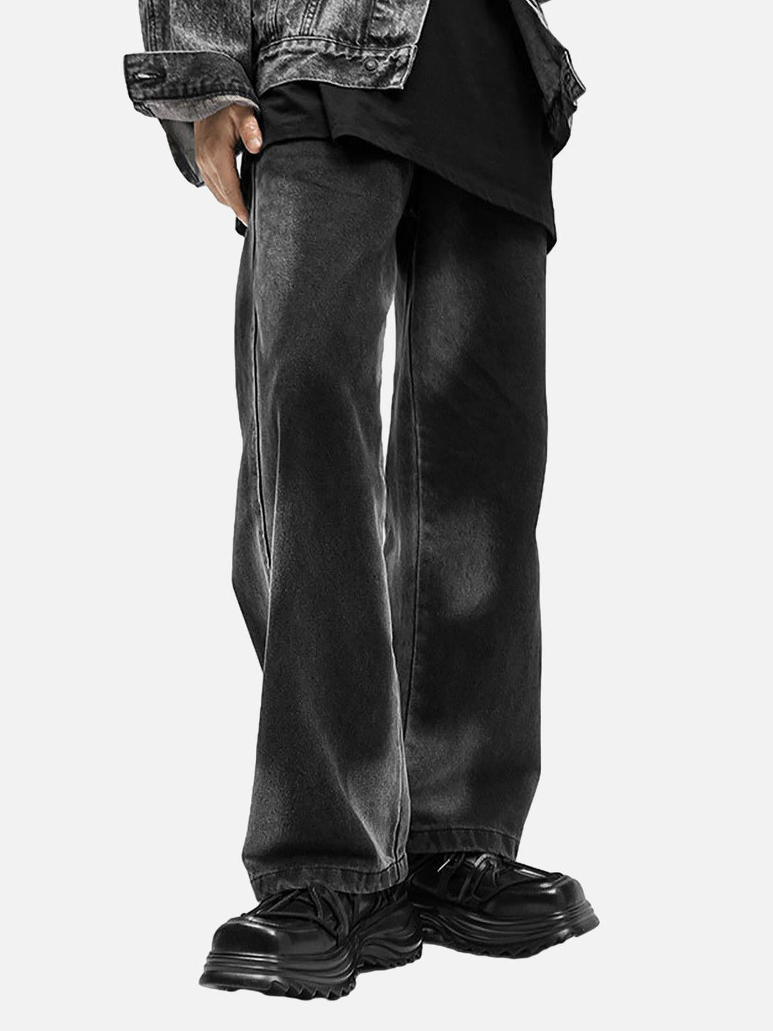 Model wearing black TALISHKO platform sneakers with wide-leg jeans, showcasing a modern workwear style.