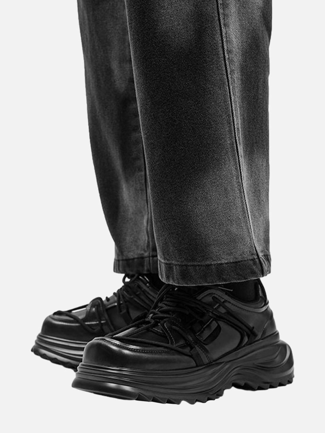 TALISHKO outdoor workwear platform sneakers in black, styled with casual jeans for a modern look.