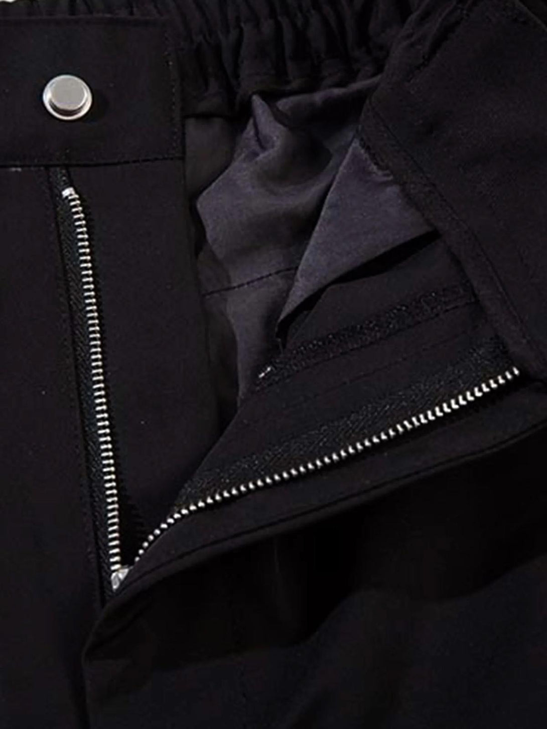 Intricate look at TALISHKO sweatpants zipper and button detail, showcasing quality craftsmanship.