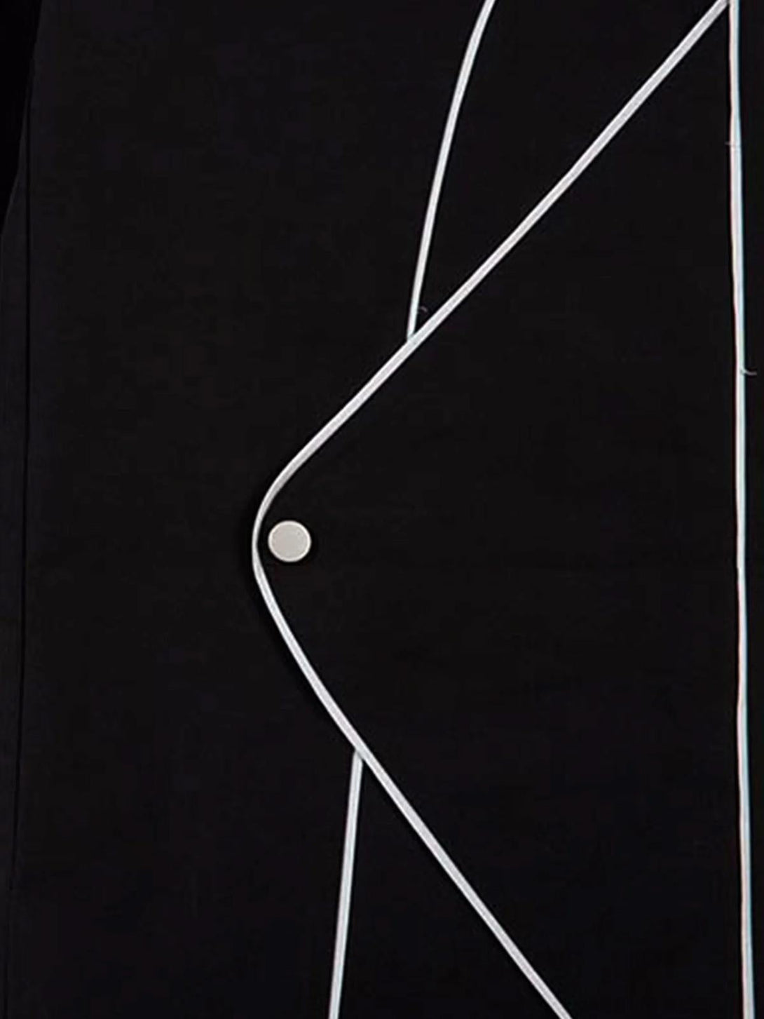 Zoomed-in detail of TALISHKO sweatpants, highlighting white outlines and bat buckle design.