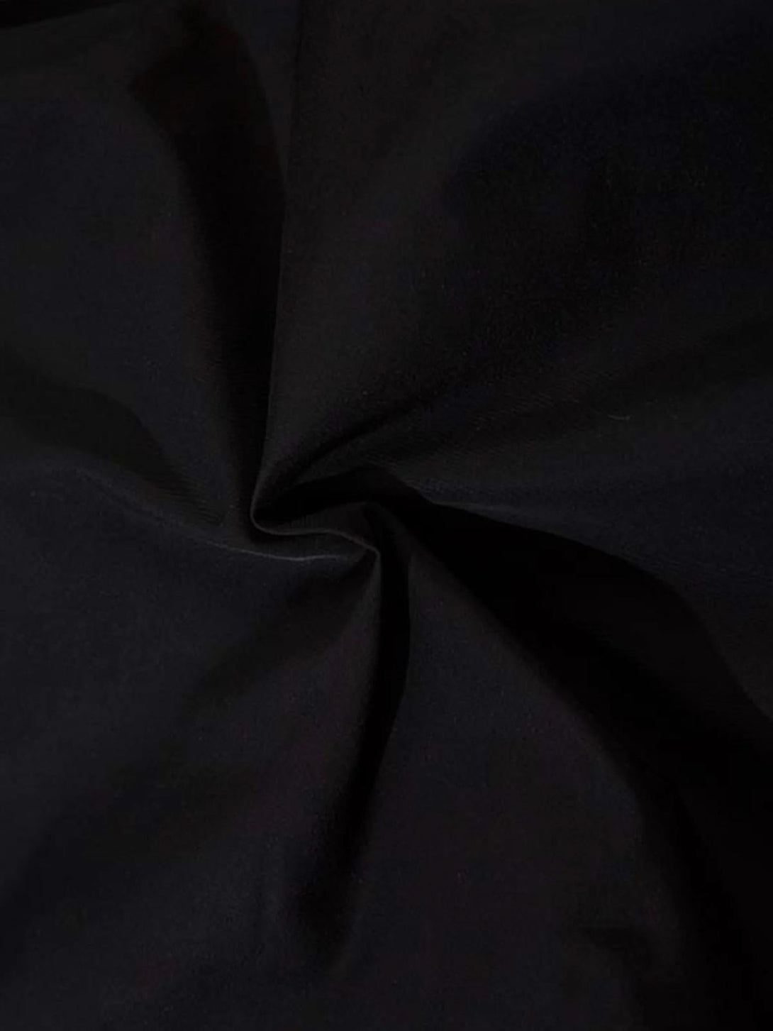 Texture and pattern of TALISHKO sweatpants fabric, highlighting subtle design details.