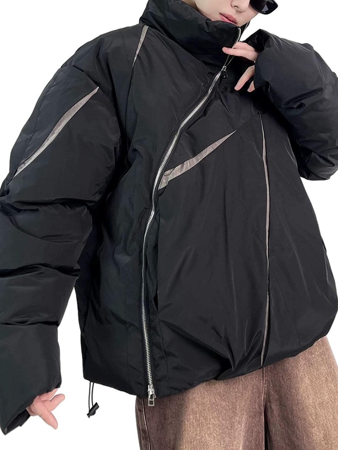 Model wearing a black oversize deconstructed cotton jacket by TALISHKO, featuring unique zipper details.