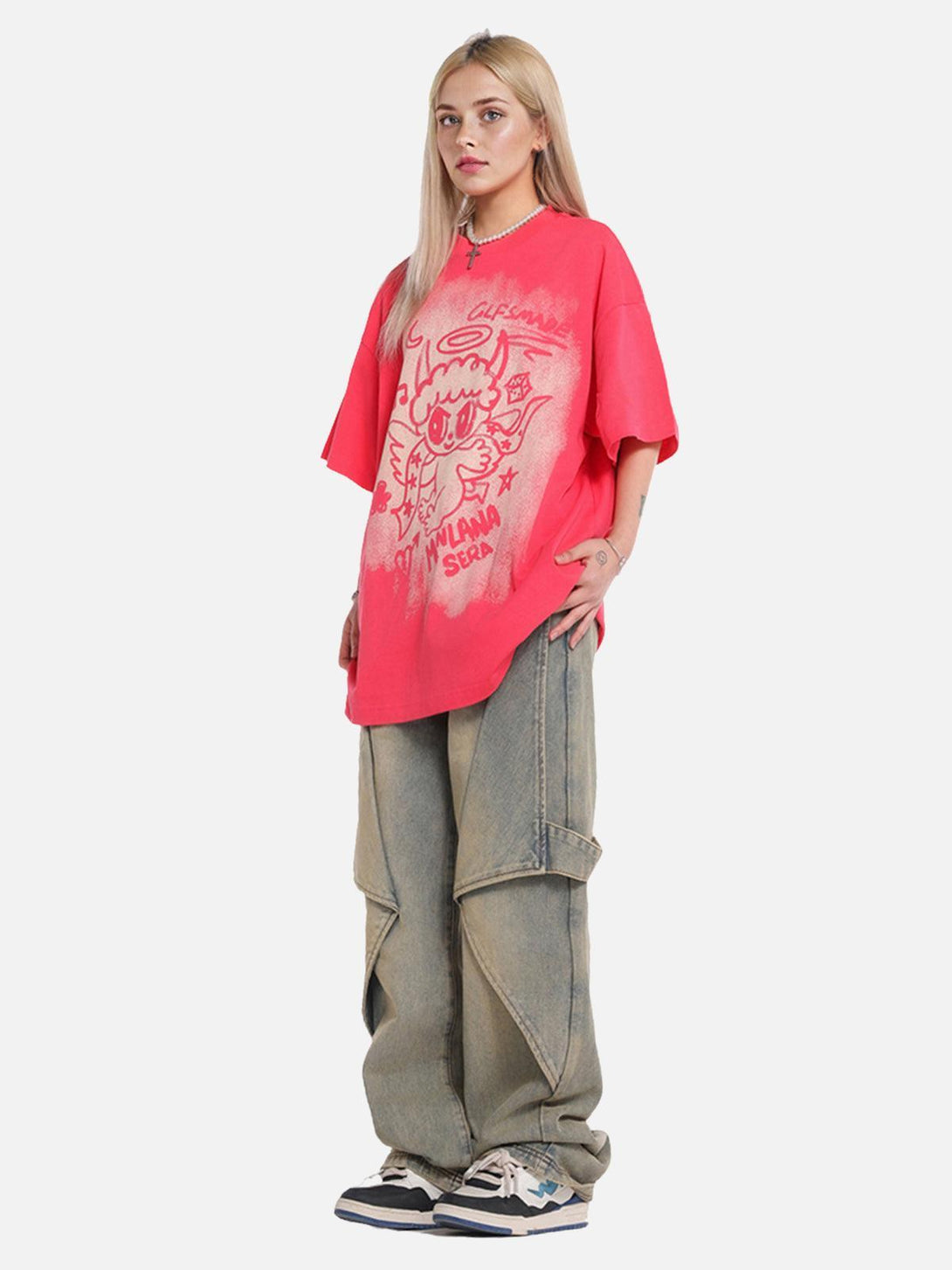 Model wearing a vibrant oversized angel graphic T-shirt by TALISHKO, paired with wide-leg jeans.