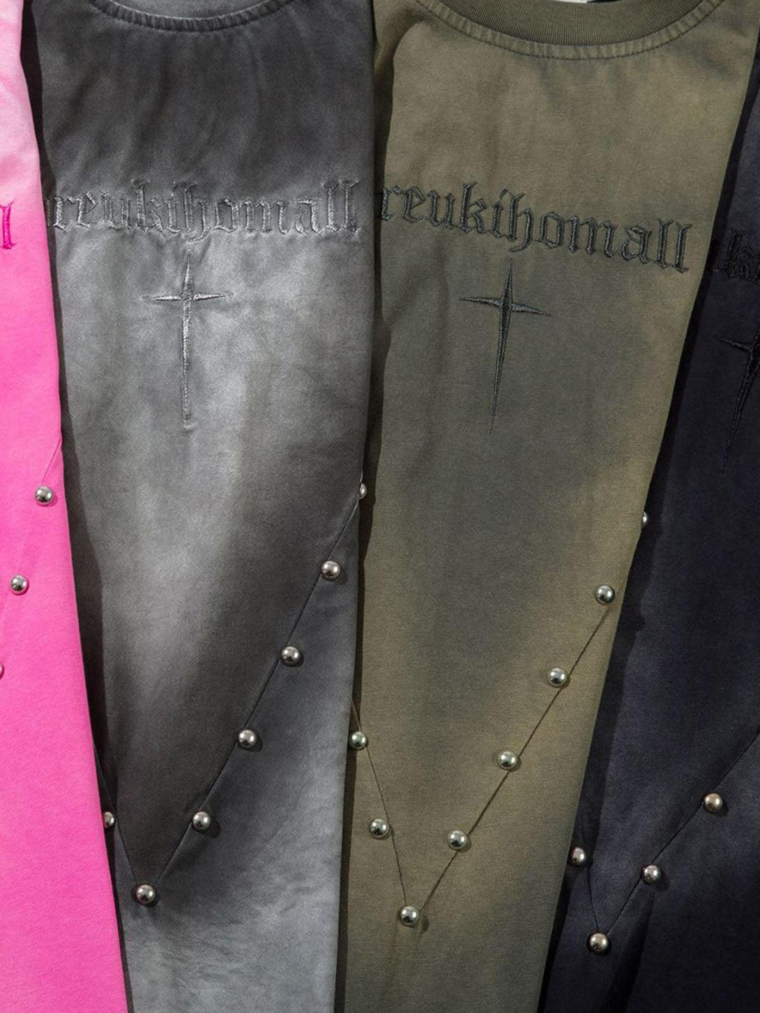 TALISHKO t-shirts in pink, gray, and green, featuring cross and stud details, for casual flair.
