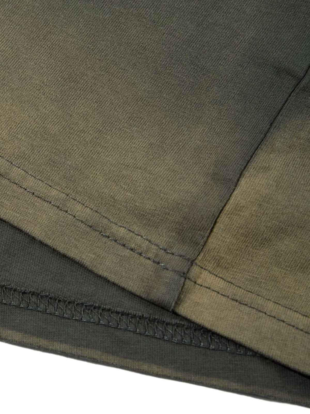 Detailed fabric and stitching of TALISHKO oversized t-shirt, showcasing quality craftsmanship.