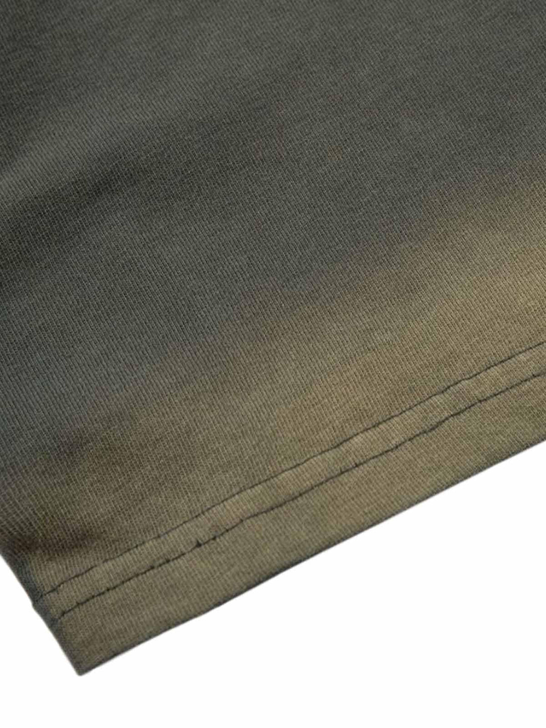 Intricate look at TALISHKO t-shirt's fabric texture, highlighting its quality and craftsmanship.