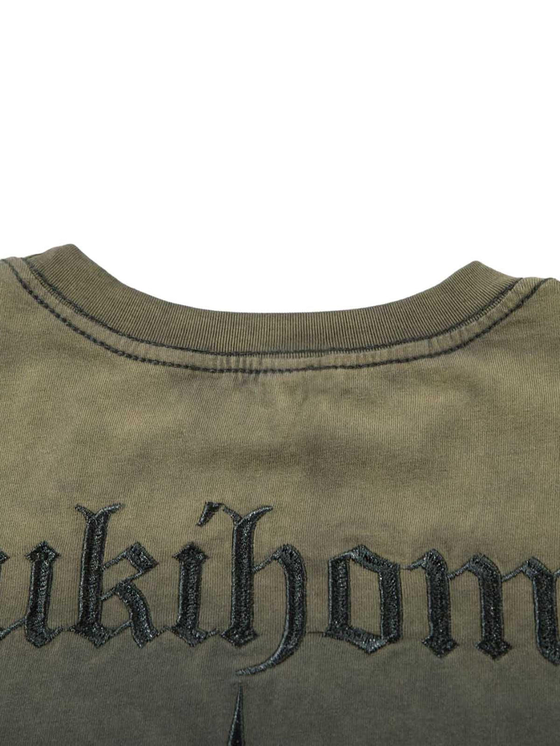 Detailed view of TALISHKO t-shirt showcasing bold lettering and intricate embroidery.