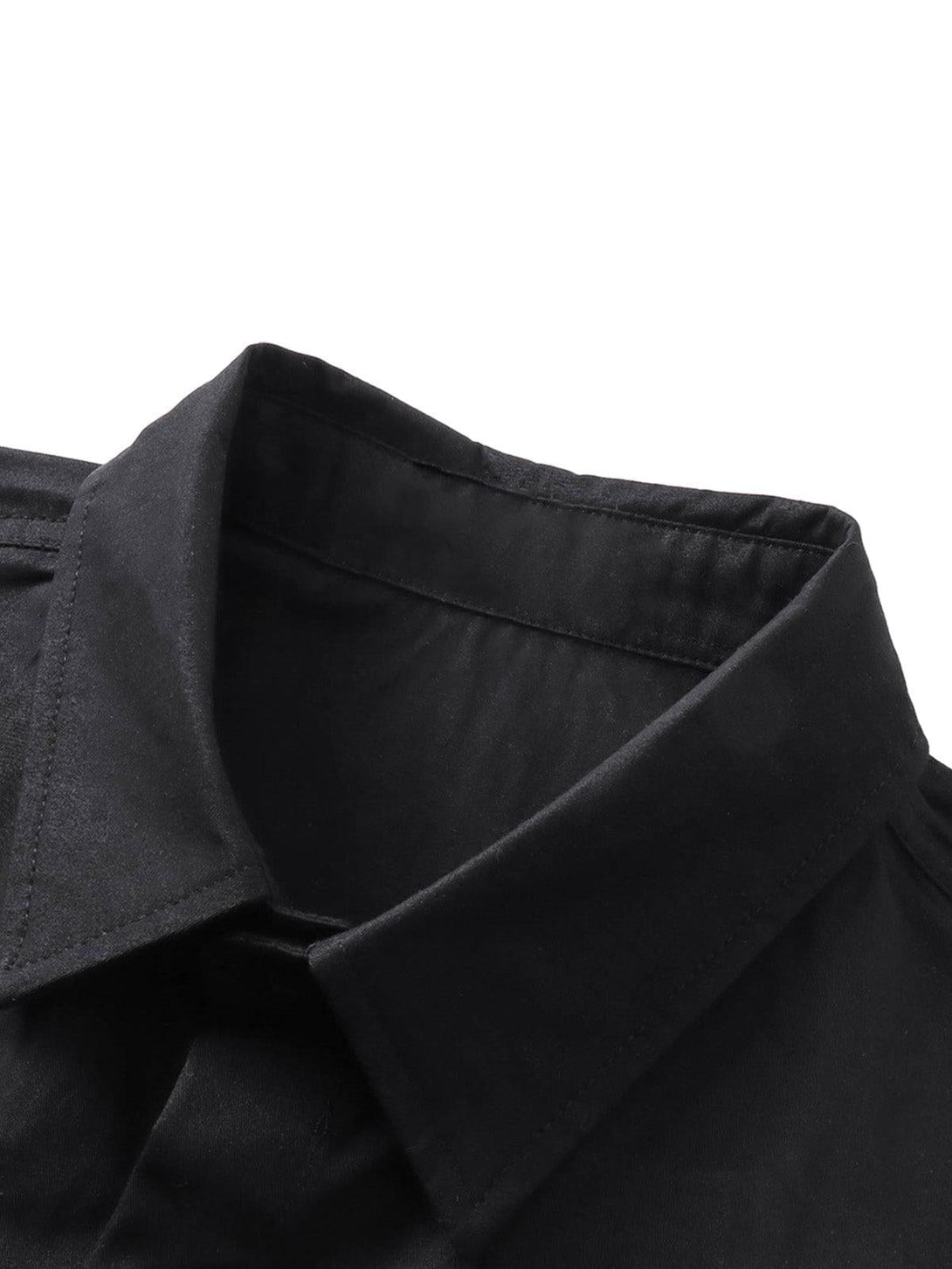 A close-up of a black shirt collar by TALISHKO, highlighting its sleek design and craftsmanship.