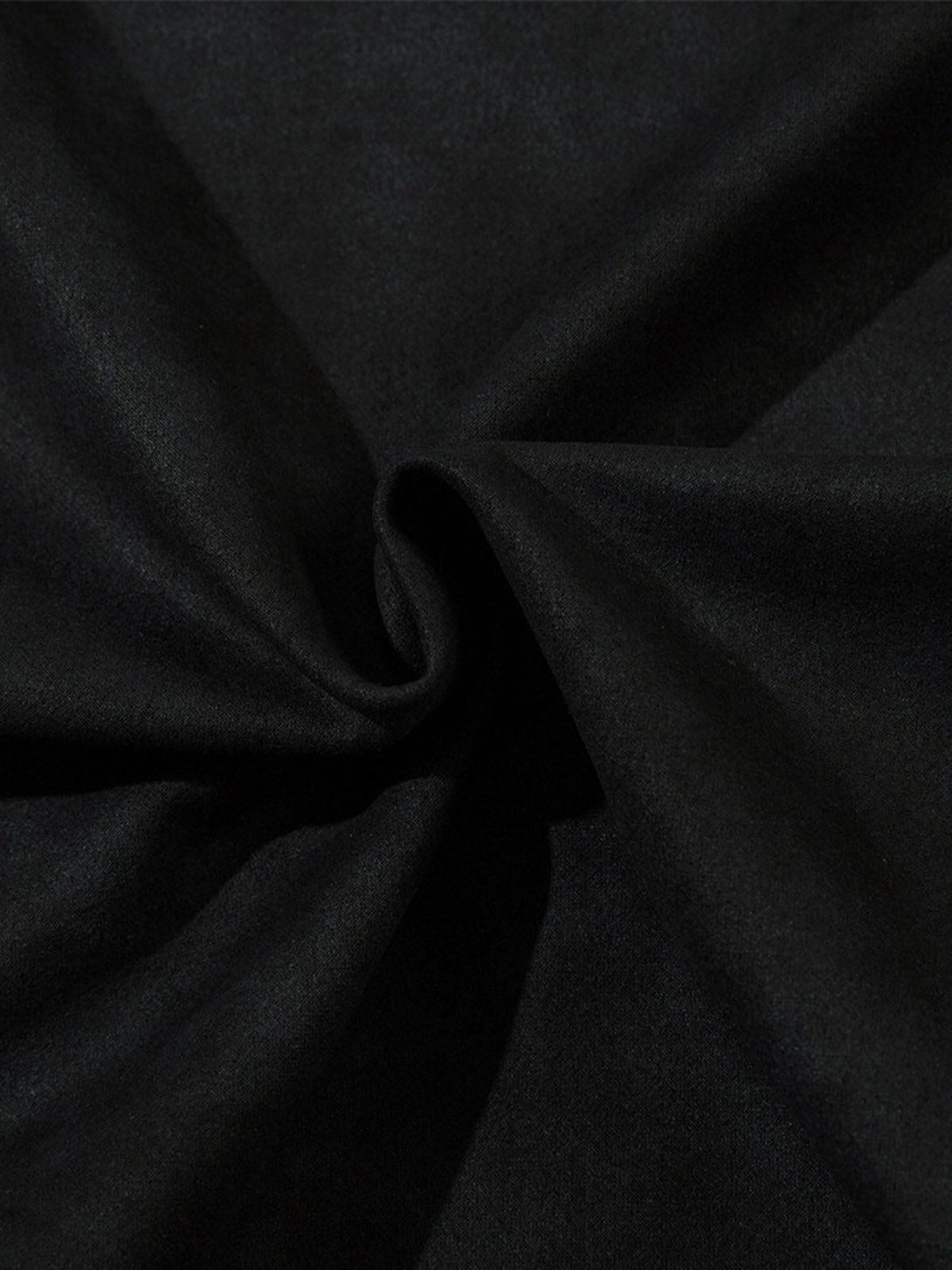 Zoomed-in texture of a black suede material by TALISHKO, showcasing its softness and quality.