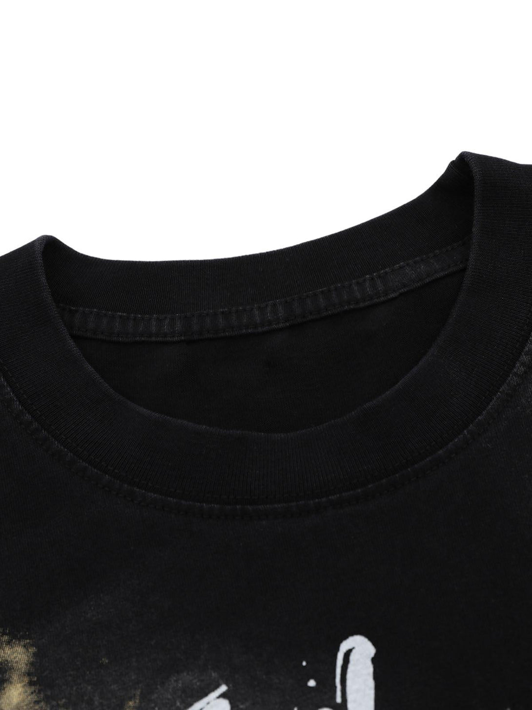 A detailed view of TALISHKO's oversized letter graphic T-shirt neckline in black, showcasing bold design.