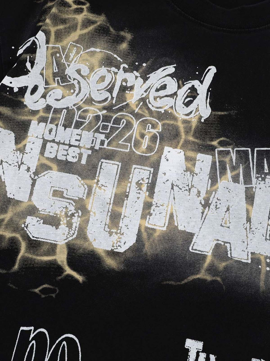 Detailed fabric and lettering of TALISHKO's oversized graphic T-shirt, showcasing bold text design.