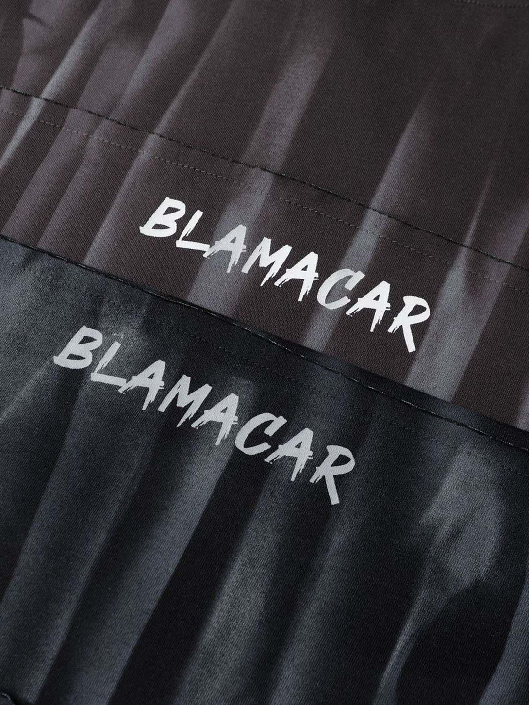 Detailed look at the tie-dye texture and embroidered lettering on a T-shirt by TALISHKO.