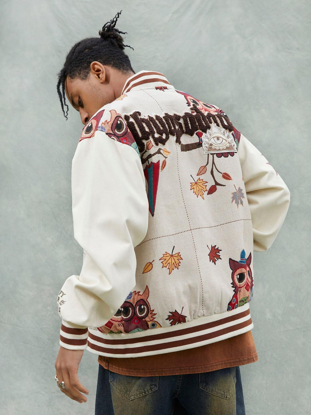Back view of a TALISHKO owl patch jacket, highlighting intricate embroidery and casual vibes.