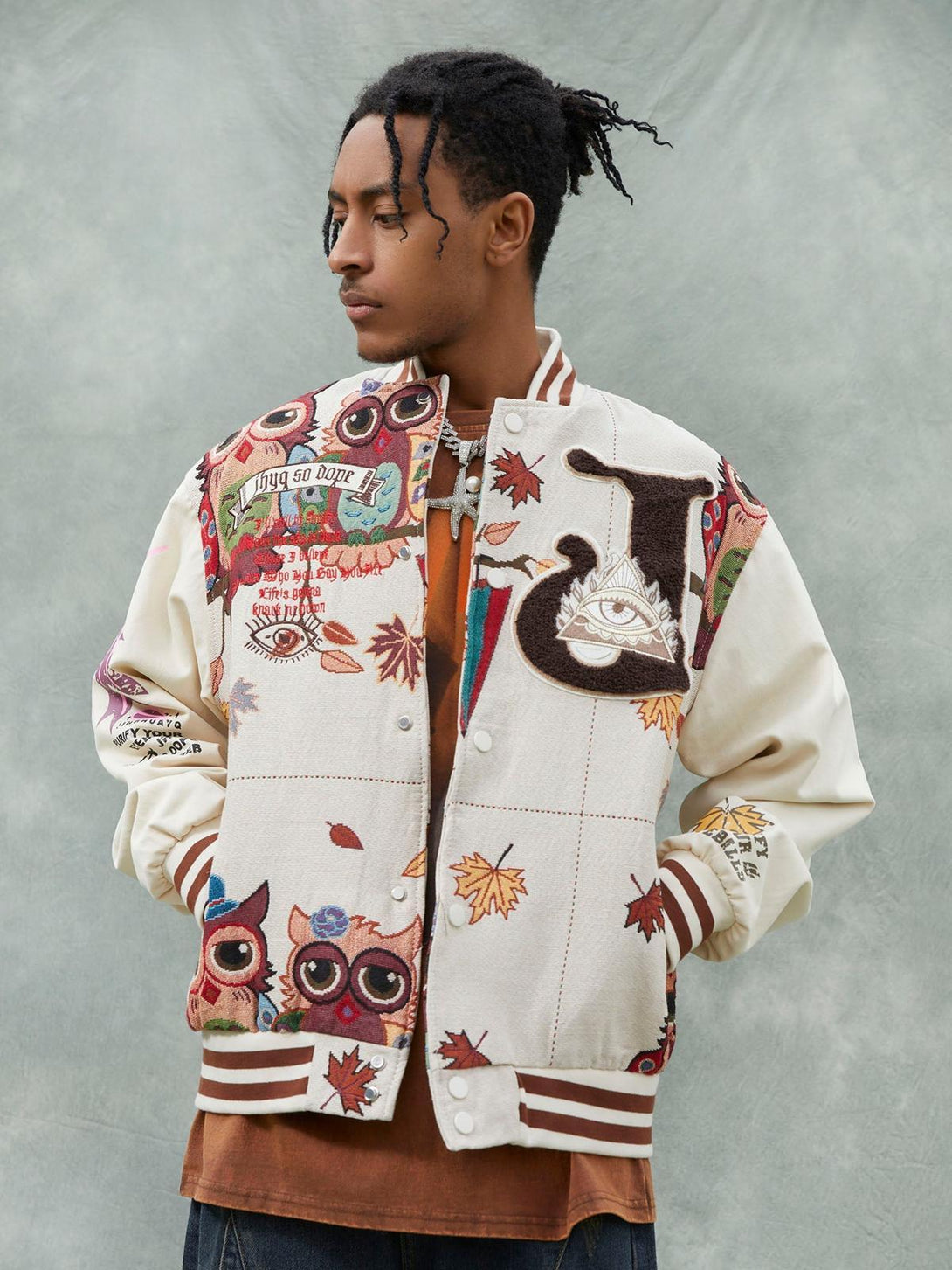 Model wearing a TALISHKO owl patch embroidered baseball jersey, paired with a casual outfit.