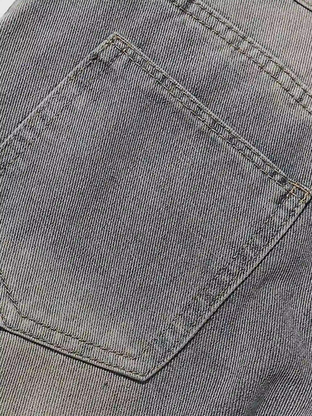 Detailed fabric and stitching on TALISHKO cargo jeans, highlighting the back pocket design.