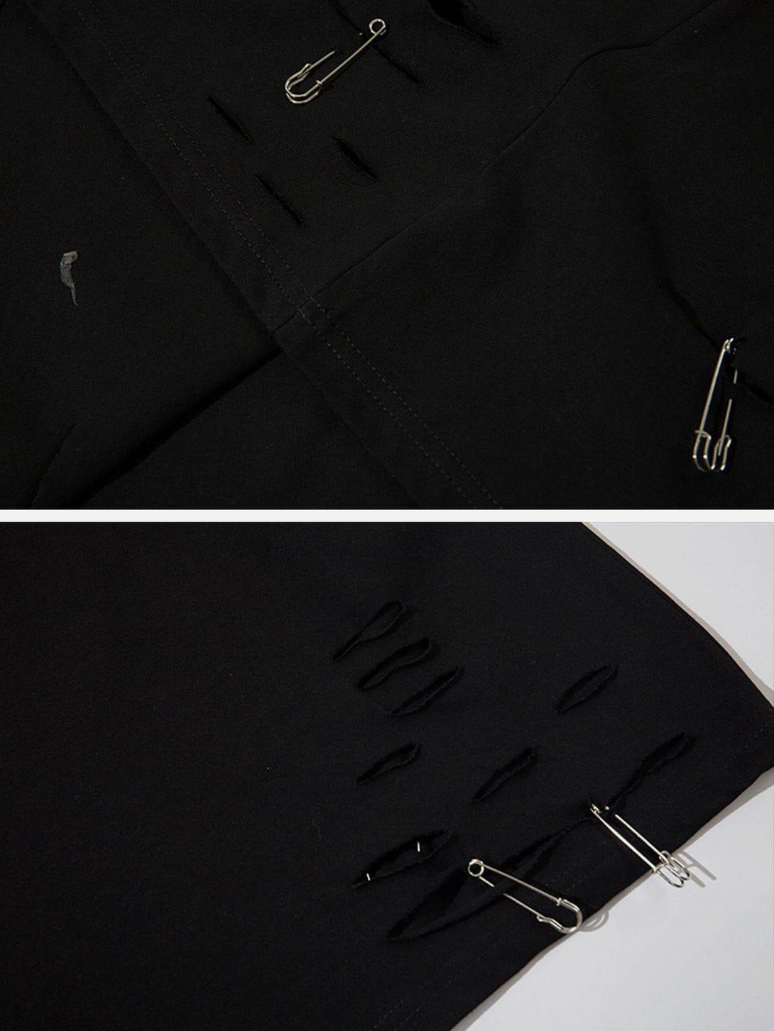 A detailed look at the black tee's paper clip accents, showcasing TALISHKO's creative design.