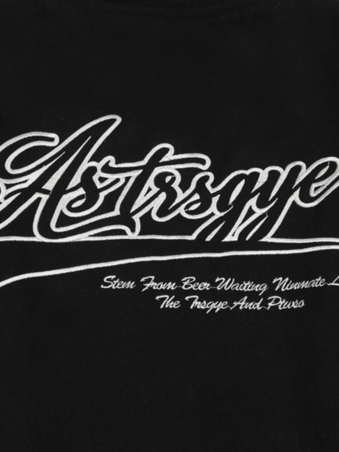 Intricate embroidery detail on TALISHKO's black baseball jacket with stylish lettering.