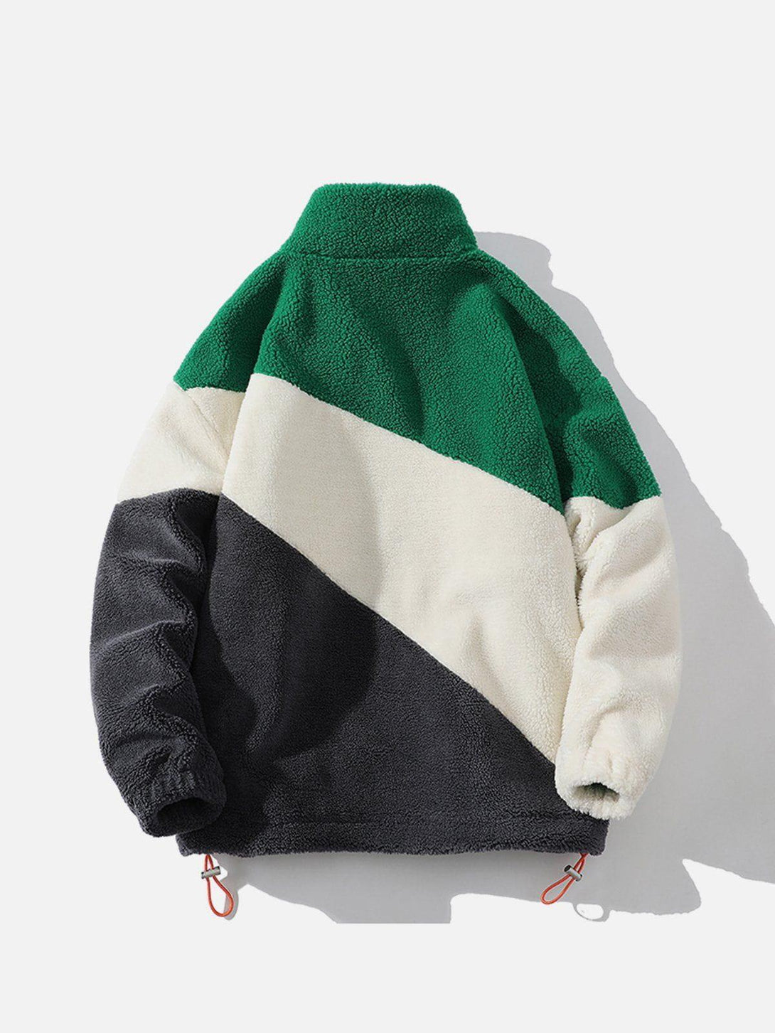 Back view of TALISHKO's patchwork sherpa coat in green, cream, and black for a bold look.