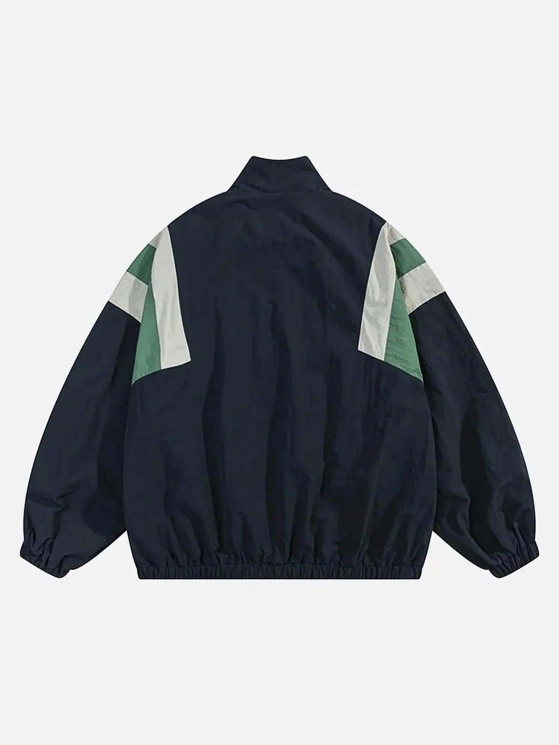 Back view of a patchwork contrasting windbreaker jacket by TALISHKO with green and white accents.