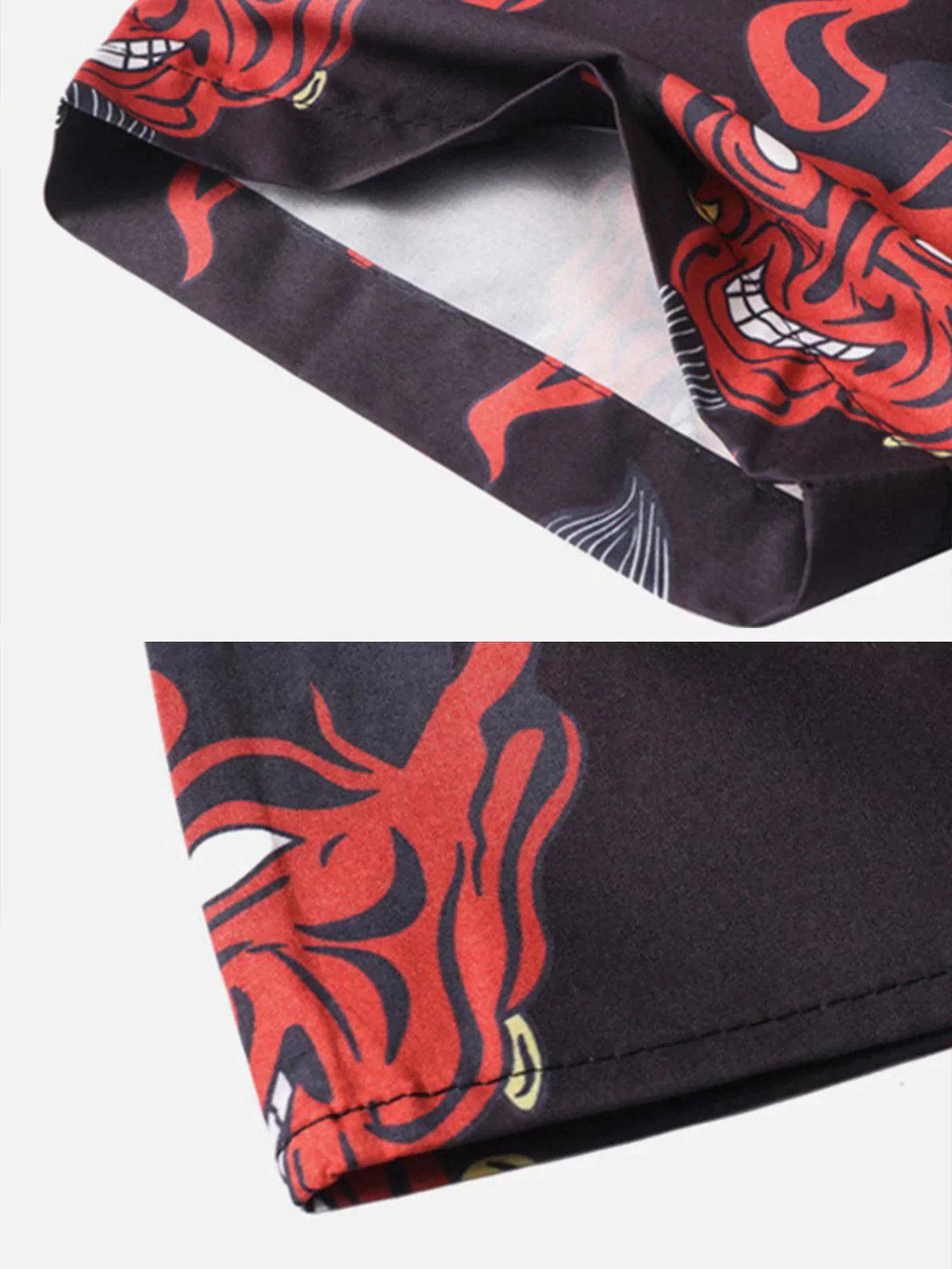 Intricate look at TALISHKO's patchwork shirt with bold red devil design and stitching details.