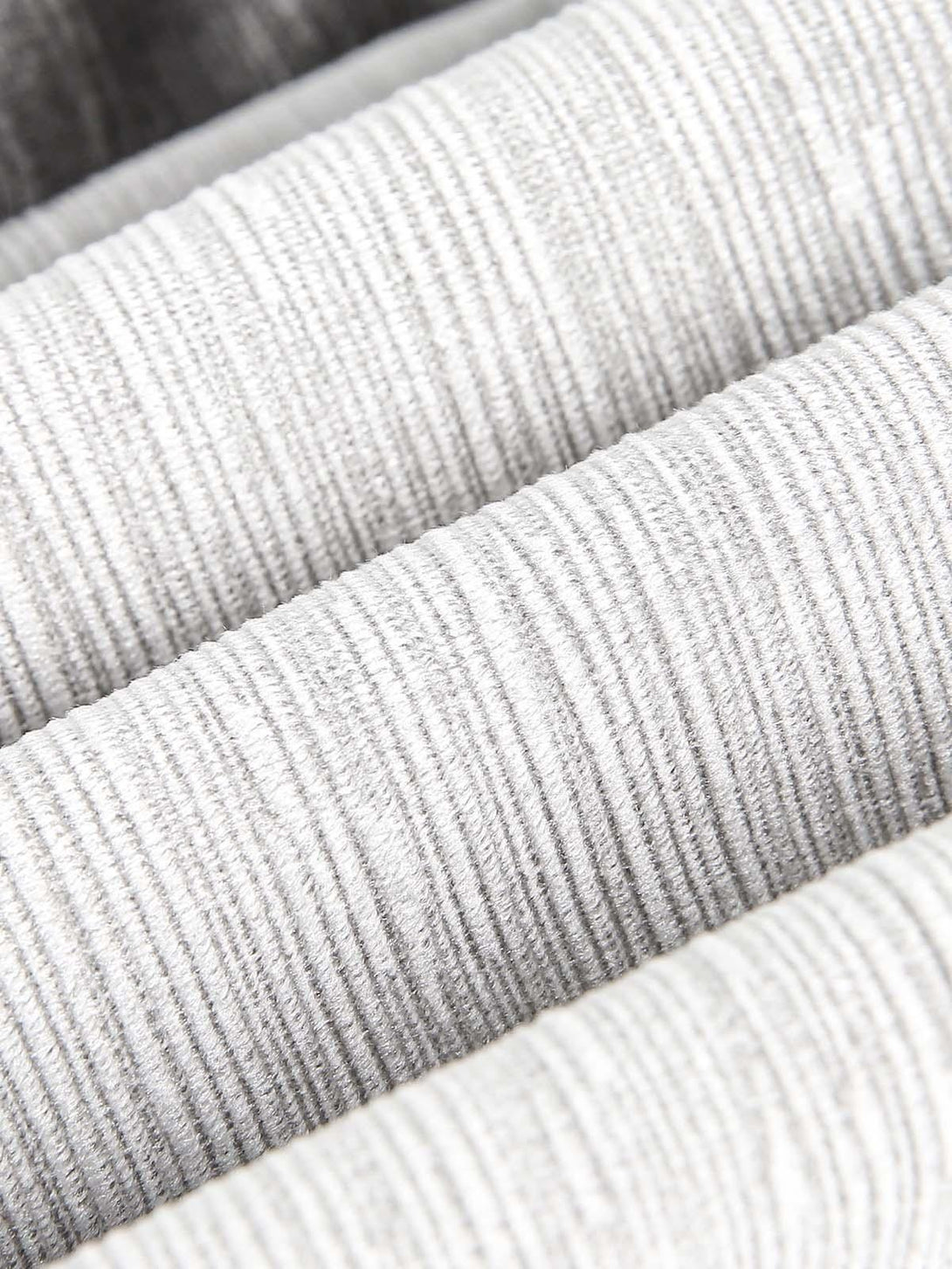 Zoomed-in texture of a TALISHKO bomber jacket, showcasing detailed patchwork design.