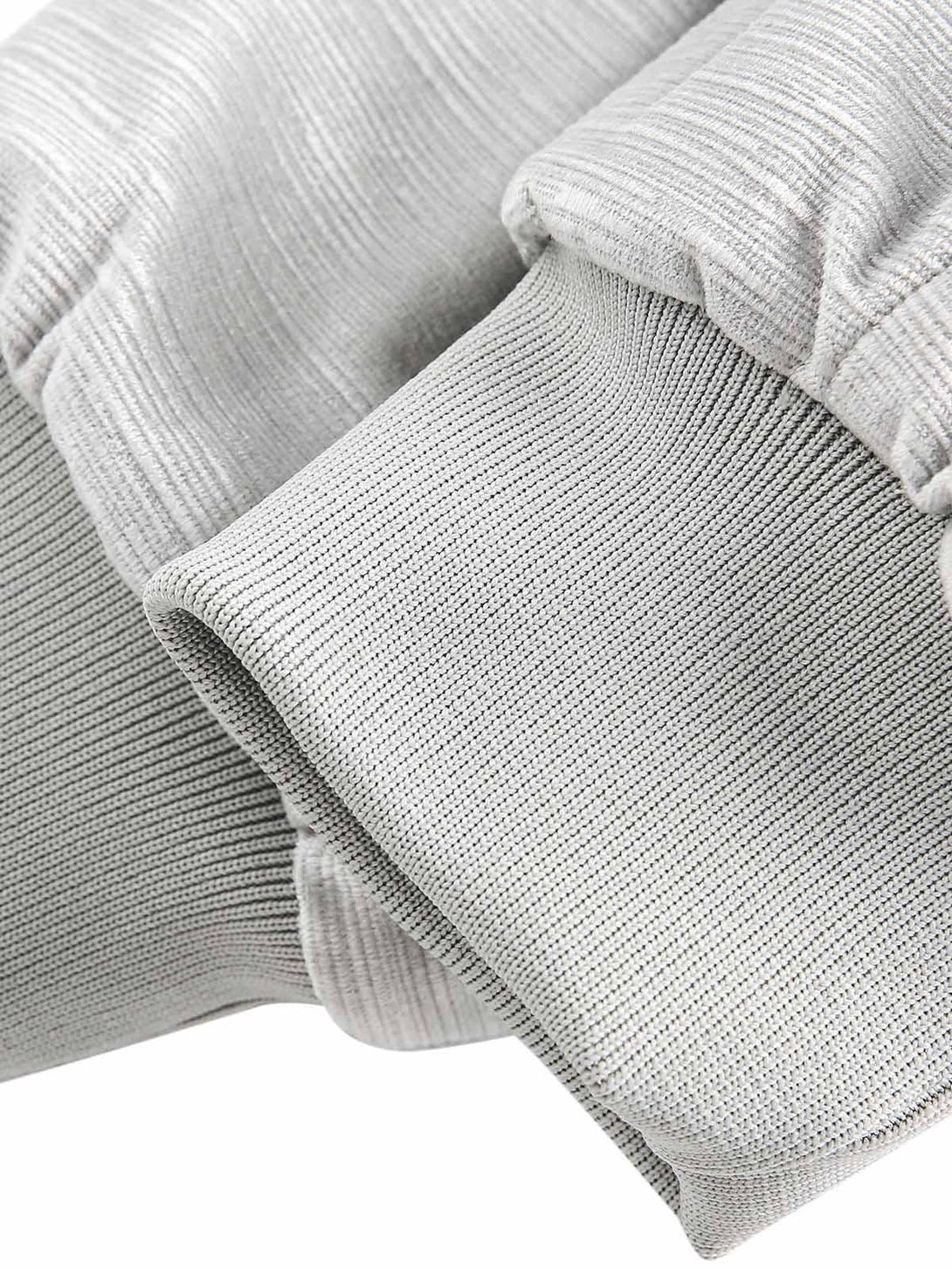 Detailed fabric texture of a TALISHKO bomber jacket, highlighting quality stitching and design.