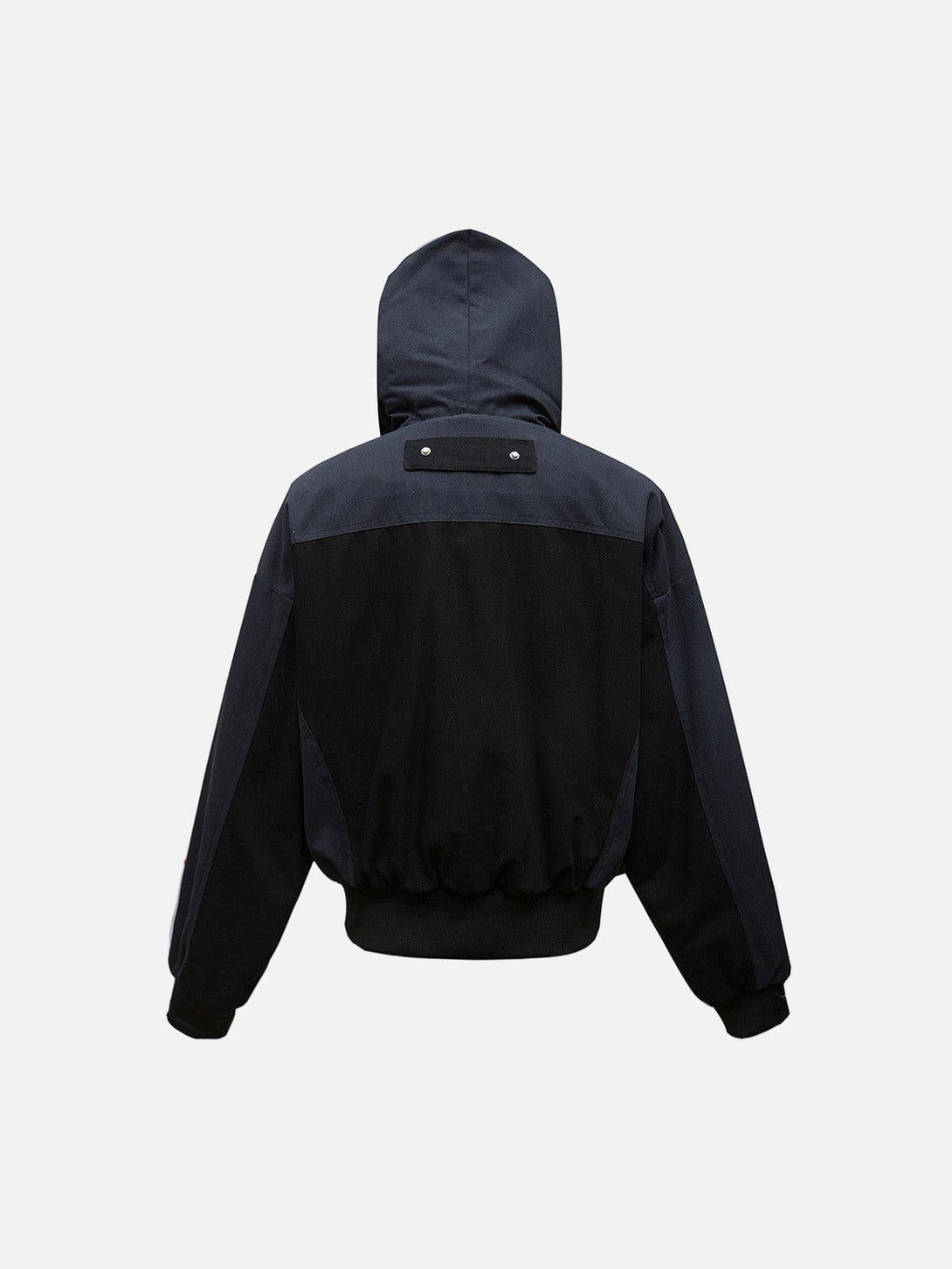 Back view of a patchwork hooded jacket by TALISHKO, showcasing its distinct design.