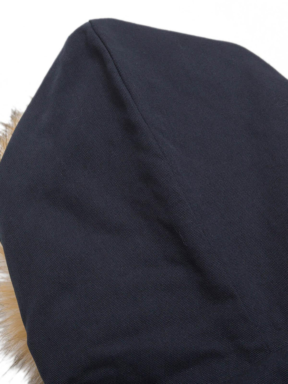 Detailed view of the navy hood on a TALISHKO jacket, showcasing fabric texture and quality.