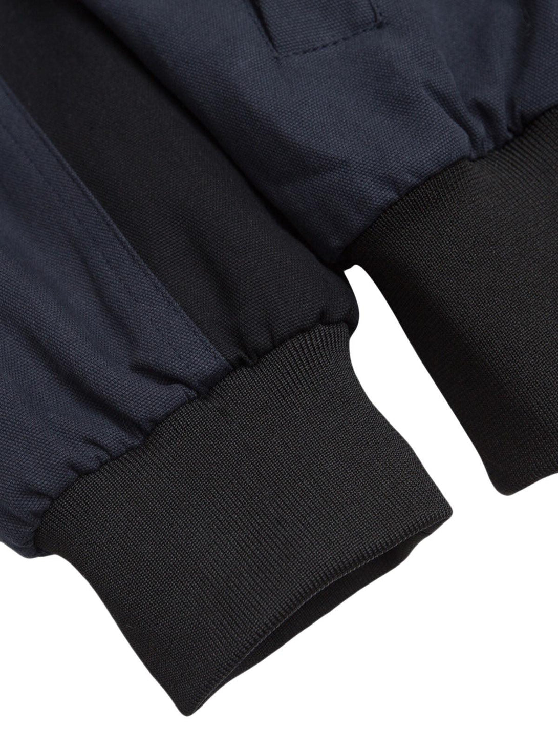 A detailed view of the ribbed cuffs on a TALISHKO jacket, showcasing craftsmanship and design.