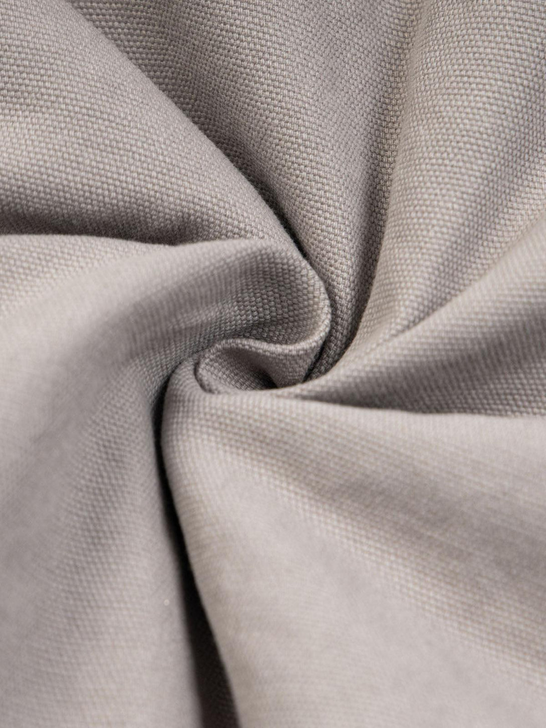 Texture and pattern showcased on TALISHKO's patchwork fur hooded jacket, highlighting fabric detail.