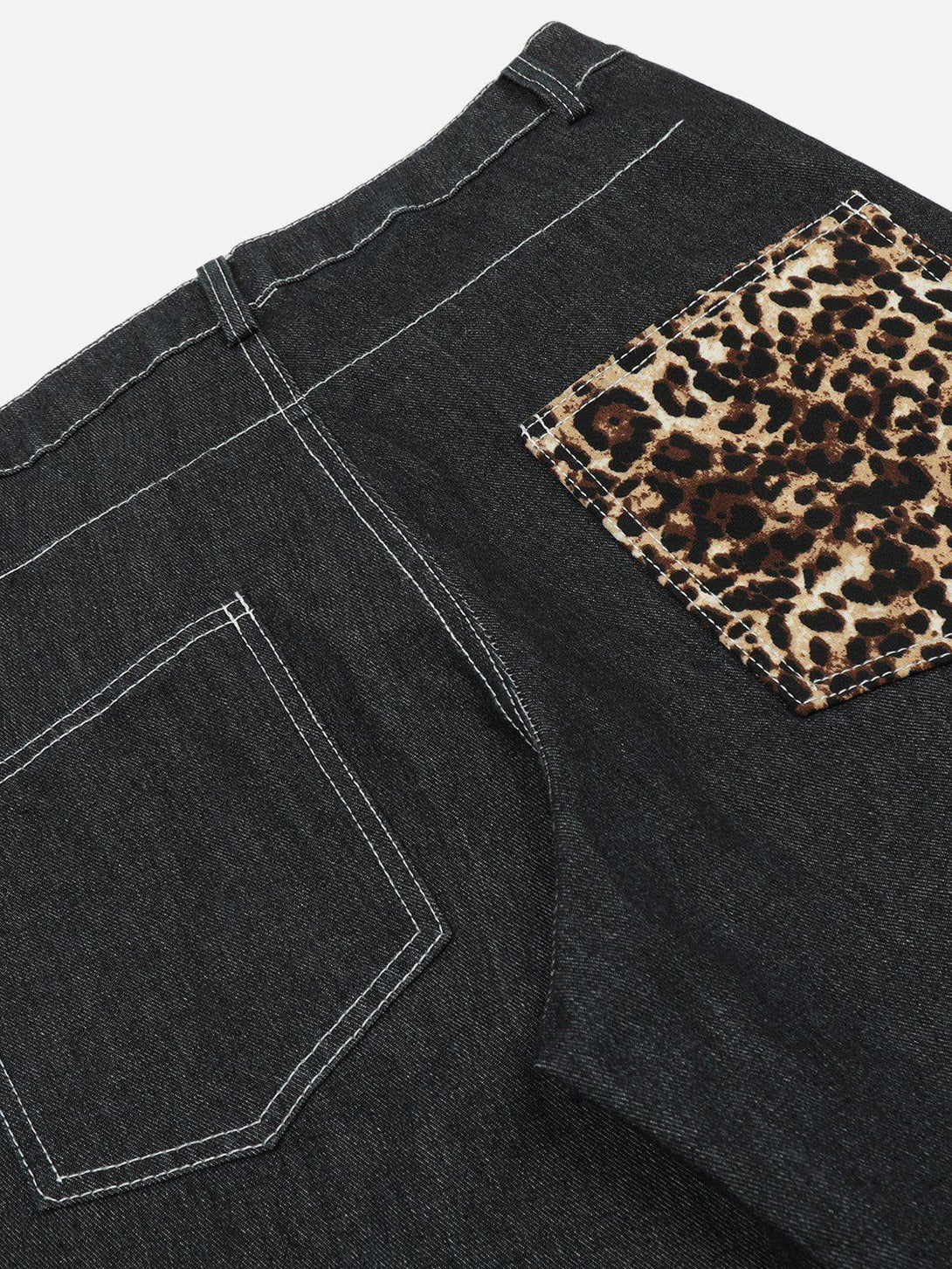A detailed view of TALISHKO jeans showcasing a leopard print pocket for a unique touch.