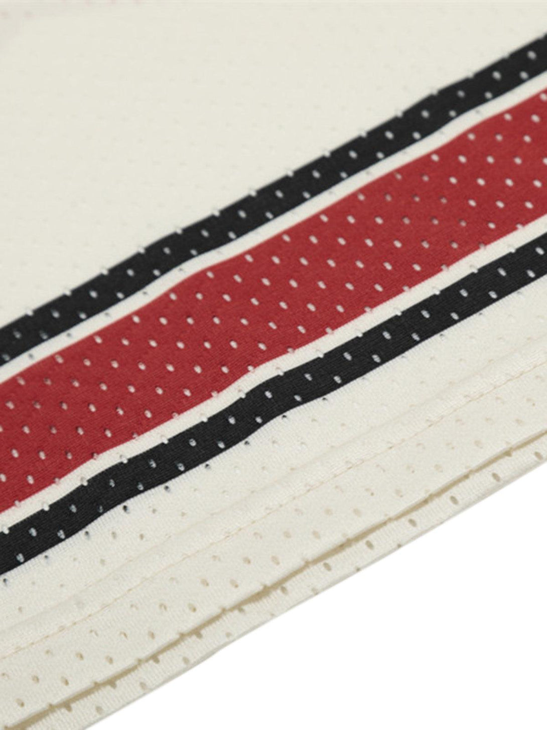 Intricate look at the TALISHKO patchwork mesh jersey T-shirt, highlighting red and black stripes.