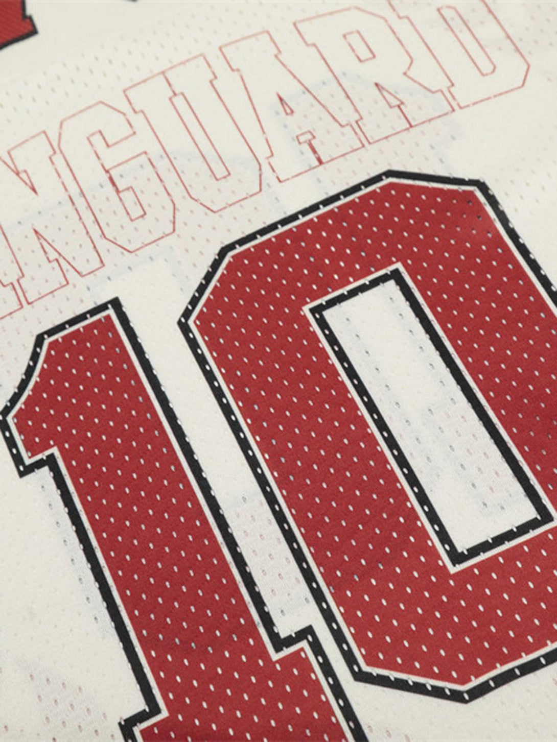 Zoomed-in view of TALISHKO patchwork mesh jersey T-shirt highlighting red number 10 print.