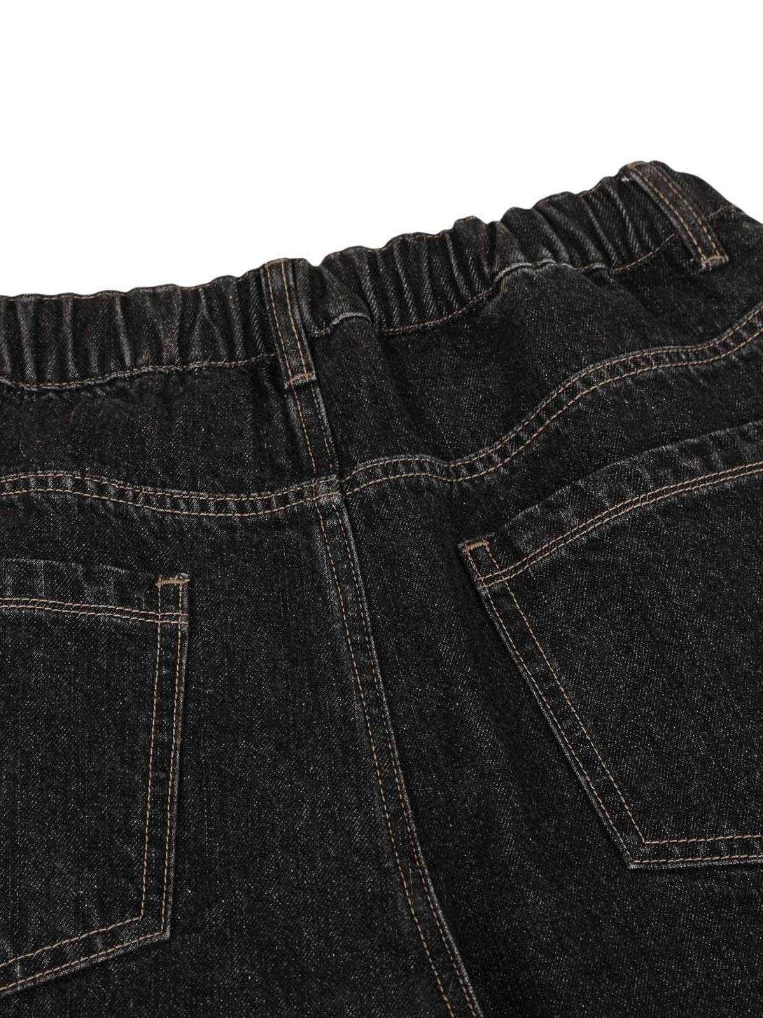 A detailed view of TALISHKO jeans' elastic waistband and pocket stitching, showcasing craftsmanship.