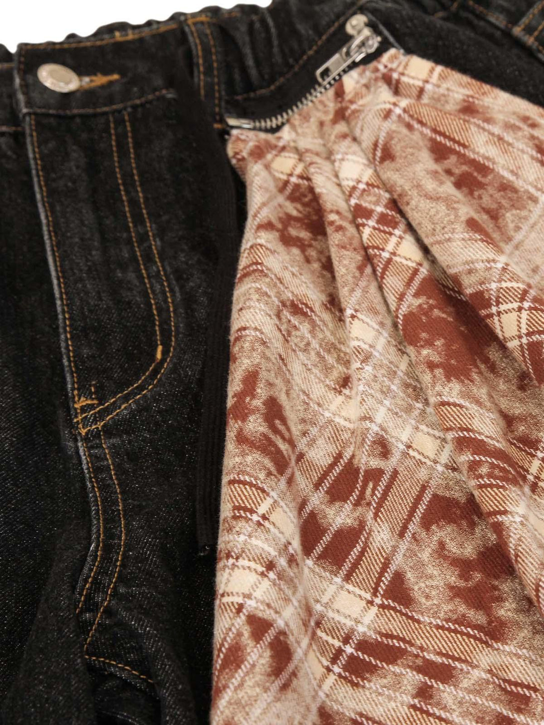 Close-up of TALISHKO jeans' plaid lining and zipper detail, showcasing unique design elements.