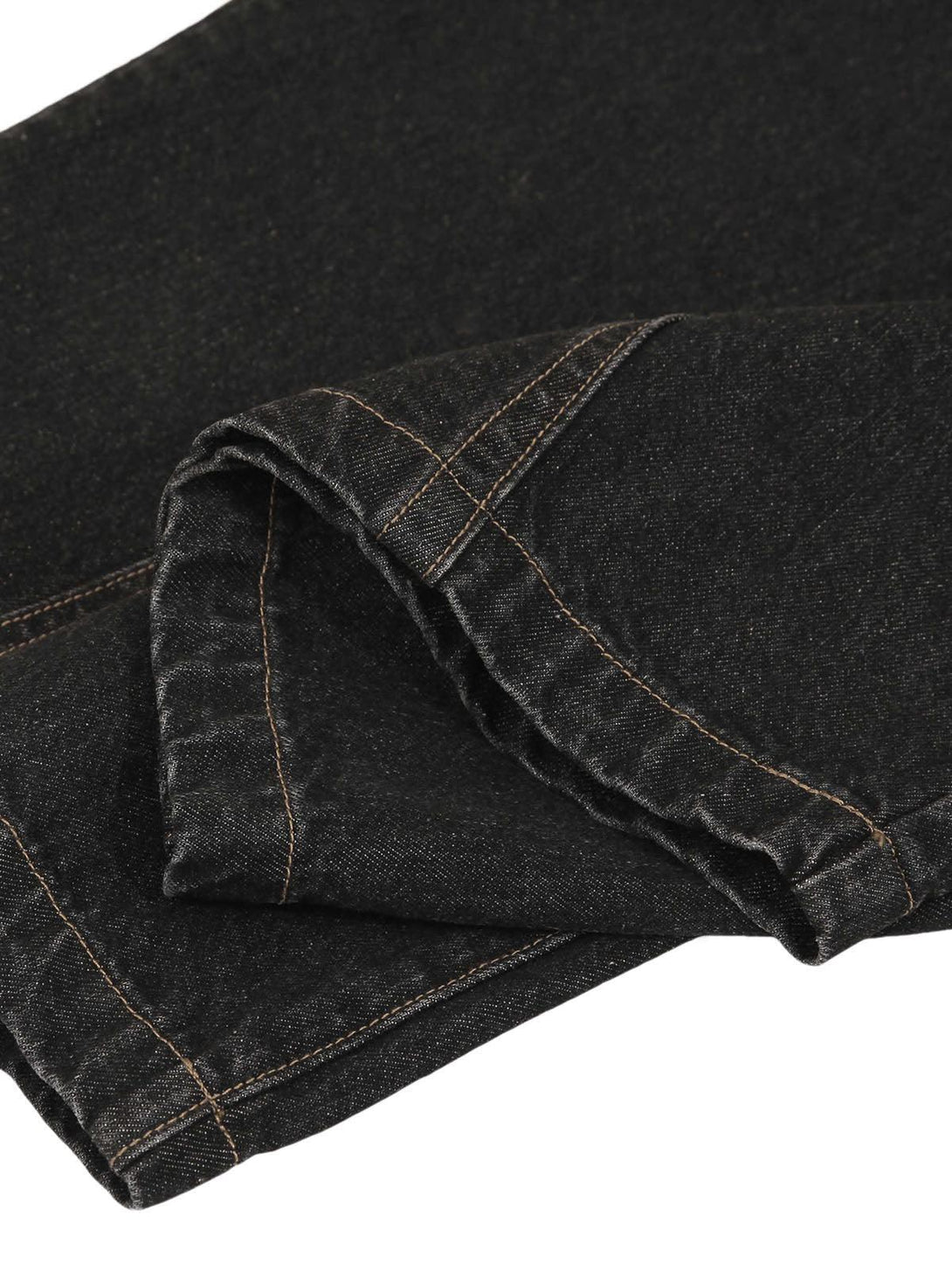 Detailed fabric and stitching of TALISHKO jeans, showcasing quality craftsmanship.