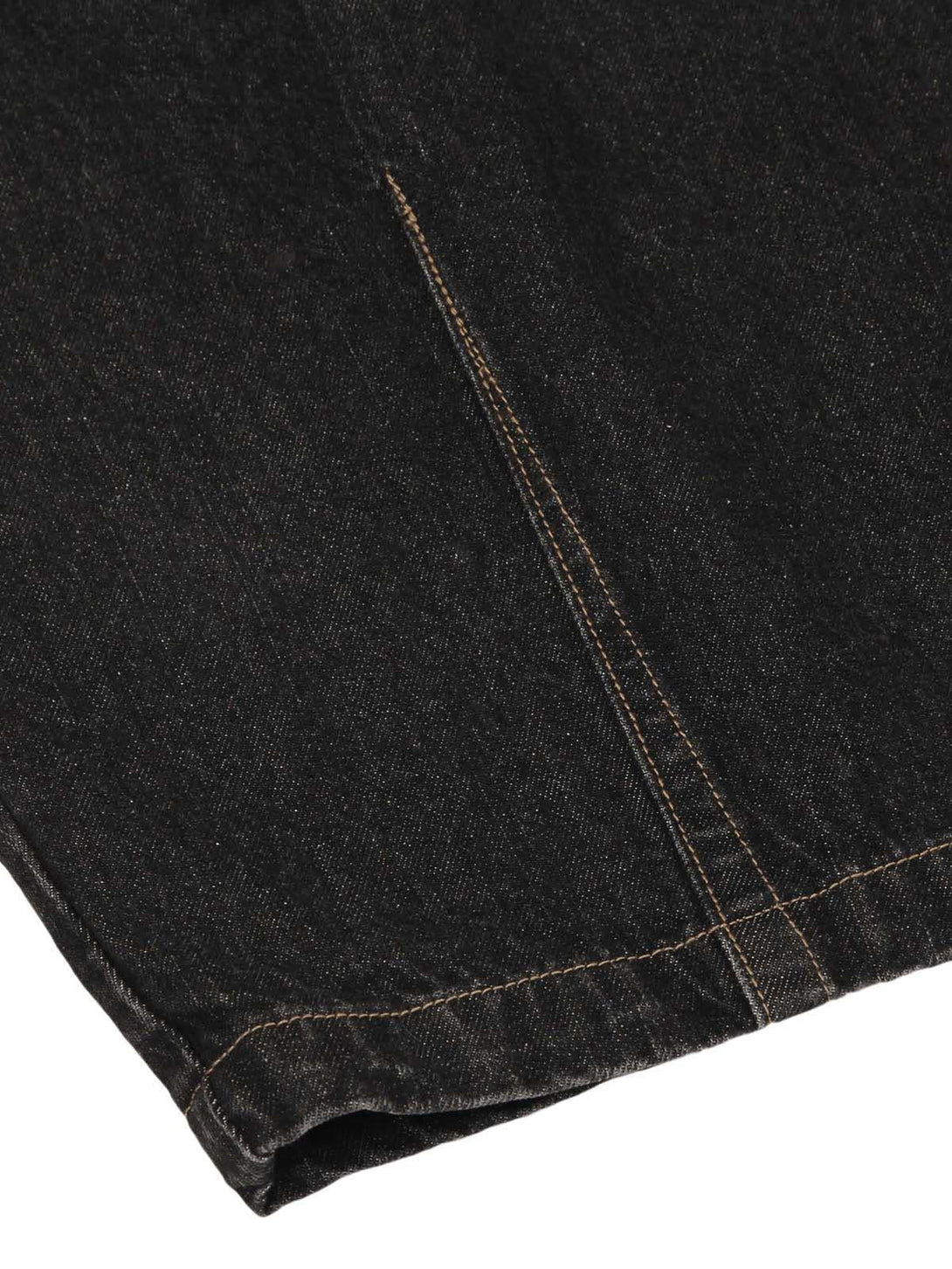 Detailed fabric and stitching on TALISHKO jeans, emphasizing craftsmanship and texture.