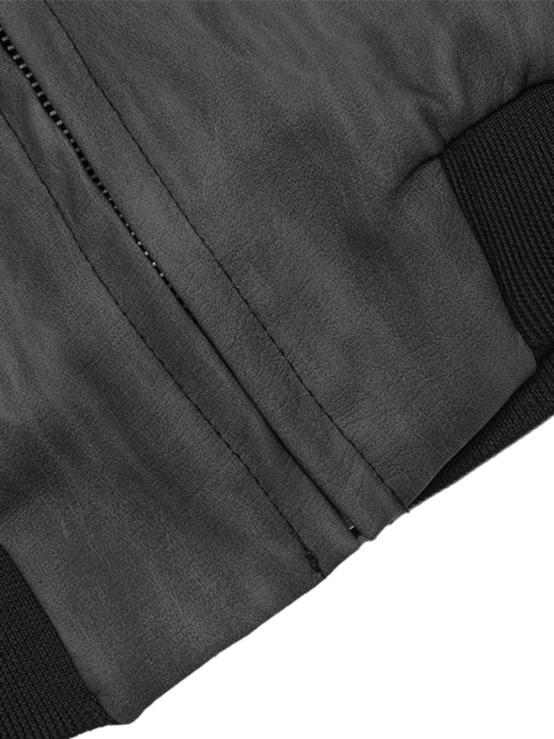 A close-up of the zipper detailing on the TALISHKO patchwork hooded jacket, emphasizing texture.