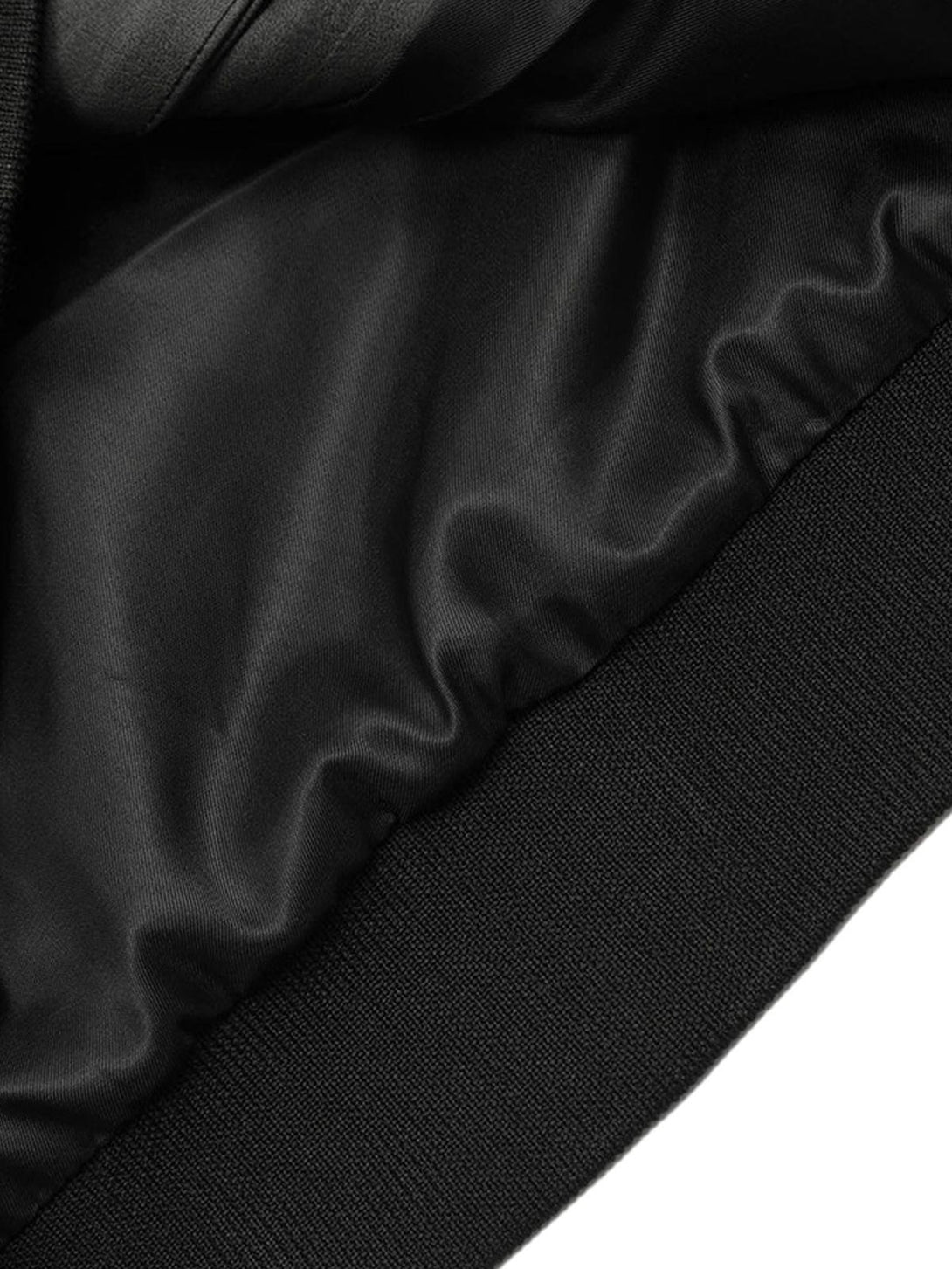 Smooth interior lining detail of the TALISHKO patchwork print zip-up hooded jacket.