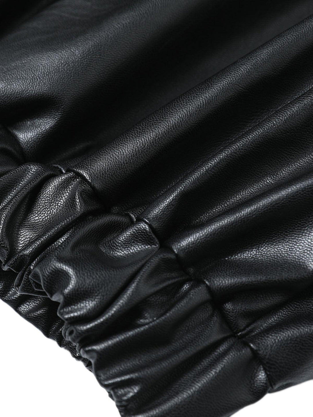 Elastic hem detail of TALISHKO's black PU leather motorcycle jacket, highlighting its texture.