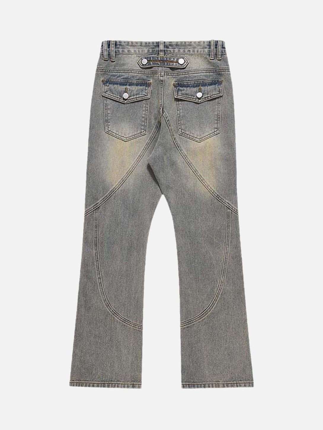 Back view of TALISHKO patchwork jeans with unique stitching and distressed pockets.