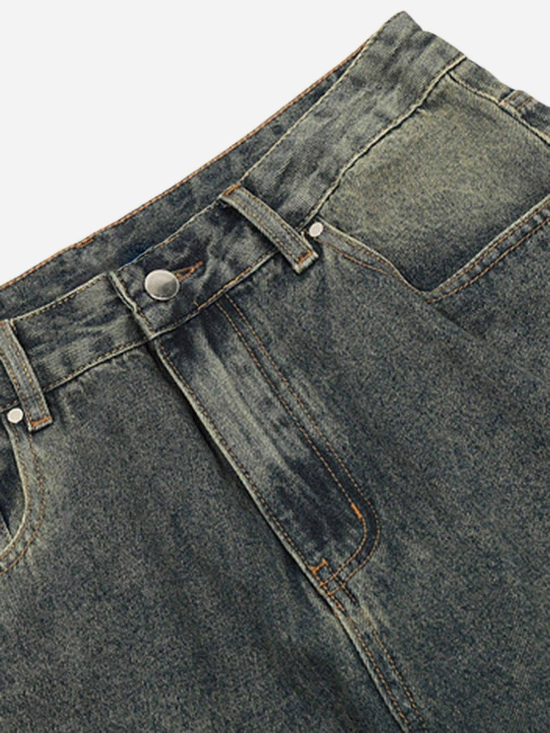 A detailed view of TALISHKO's patchwork micro flare jeans, highlighting unique stitching details.
