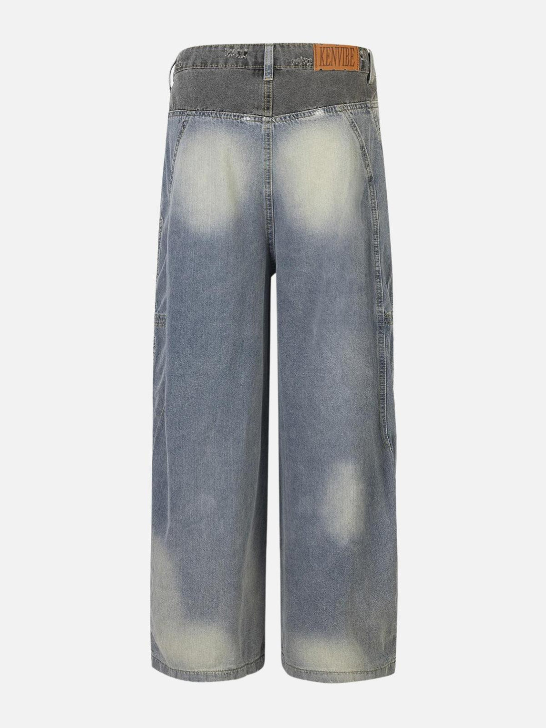 Back view of TALISHKO's loose jeans with patchwork waist, highlighting faded details.