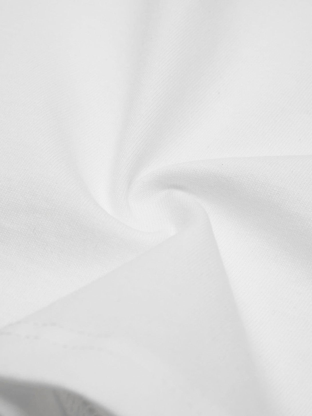 Detailed fabric and stitching texture of a TALISHKO street rap T-shirt, capturing casual style.