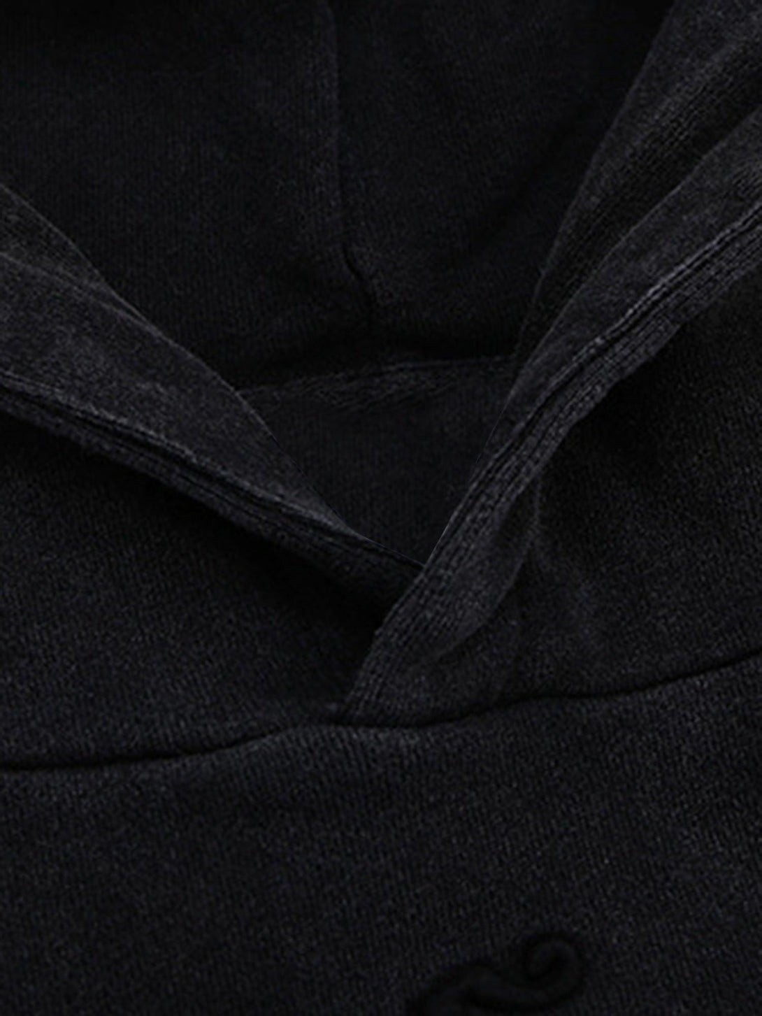 Intricate look at TALISHKO hoodie fabric and stitching, highlighting texture and quality.
