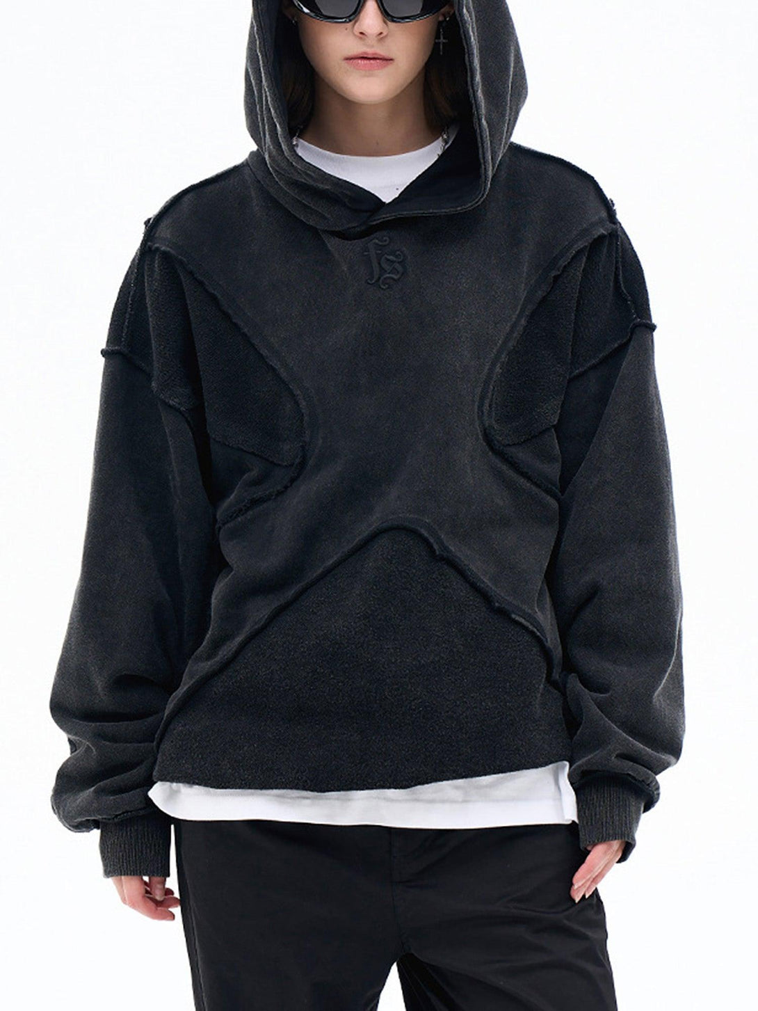 TALISHKO hoodie with a distinctive design worn by model, highlighting urban casual style.